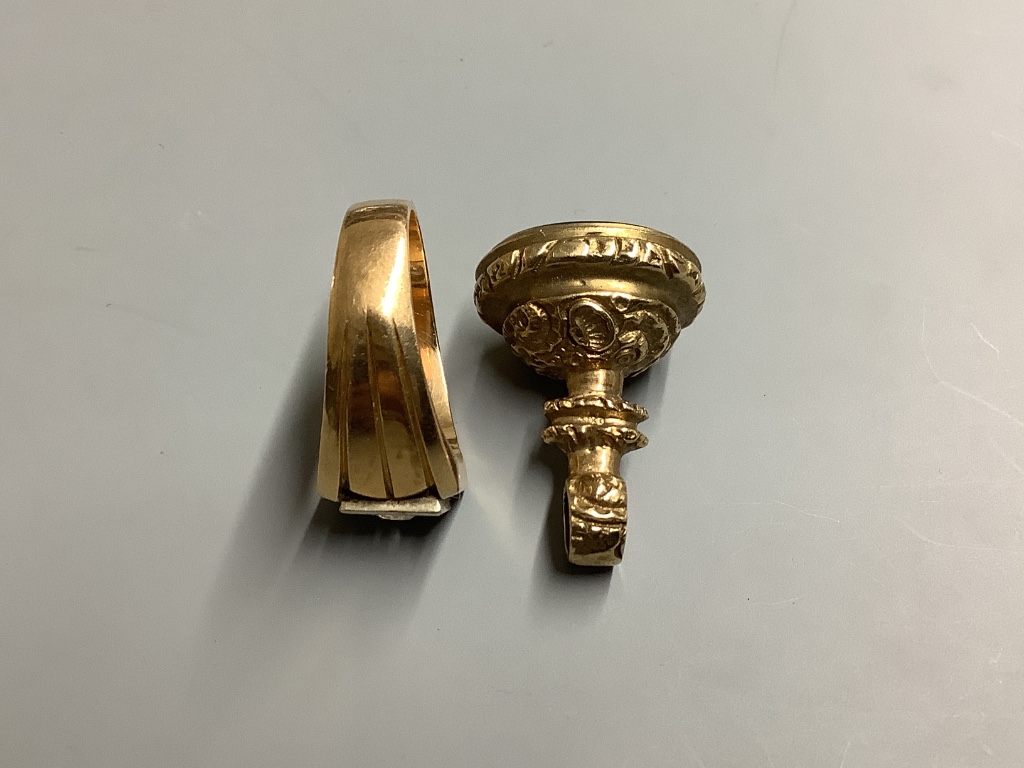 A yellow metal and paste? set signet ring, size U/V, gross weight 14 .1 g, together with a yellow metal overlaid and black onyx fob seal.